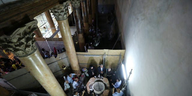 Palestinian Minister and Head of Restoration Commission for Church of the Nativity, Ziad al-Bandak (C) holds a press conference on the discovery of a baptismal font at the Church of the Nativity in Bethlehem, West Bank on June 22, 2019.