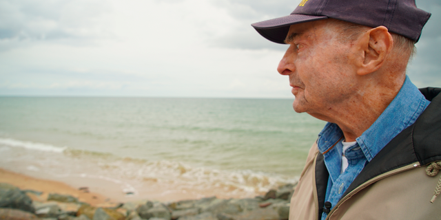 D-Day survivor Ray Lambert looks out over Omaha Beach in June. (AP Photo/Allen G. Breed)