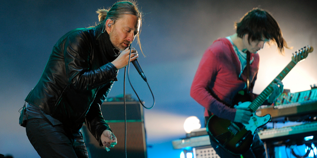 FILE - In this April 14, 2012 file photo, Thom Yorke, left, and Jonny Greenwood of Radiohead perform during the band's headlining set at the 2012 Coachella Valley Music and Arts Festival in Indio, Calif. Radiohead says a trove of unreleased music has been stolen and is being used for ransom, but instead of paying up, the band announced Tuesday June 11, 2019, they will release it in aid of environmental activist group Extinction Rebellion.(AP Photo/Chris Pizzello, File)