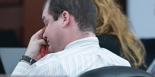 Tim Jones, Jr. wipes his eyes while hearing his grandmother testify during the sentencing phase of his trial in Lexington, S.C., Monday, June 10, 2019. Timothy Jones, Jr. was found guilty of killing his 5 young children in 2014. (Tracy Glantz/The State via AP, Pool)