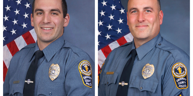 FILE - This combination of undated photos provided by the Gwinnett County Police Department shows Master Police Officer Robert McDonald, left, and Sgt. Michael Bongiovanni in their official portraits. Video from an April 2017 traffic stop in Georgia shows Bongiovanni hitting Demetrius Hollins as he stood with his hands up and McDonald stomping on Hollins’ head as he lay on the ground handcuffed. (Gwinnett County Police Department via AP)
