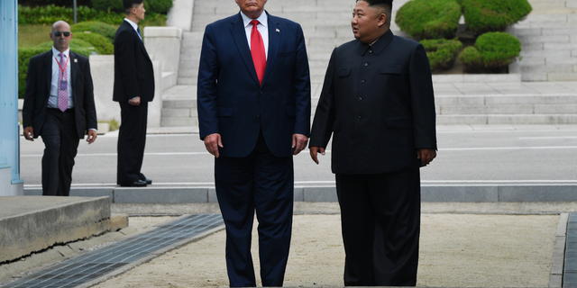 President Donald Trump and North Korean leader Kim Jong Un, stand on the North Korean side of the border in the Demilitarized Zone, Sunday, June 30, 2019 in North Korea. (AP Photo/Susan Walsh)