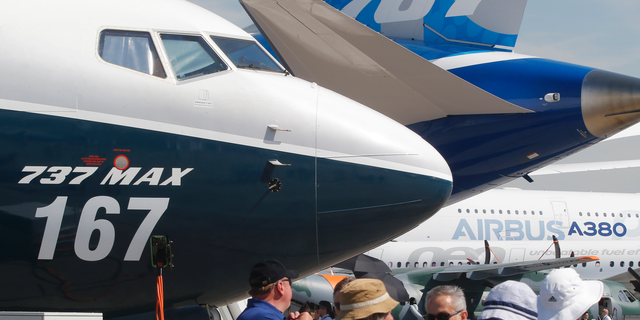 FILE - In this June 20, 2017, file photo Boeing planes displayed at Paris Air Show, in Le Bourget, east of Paris, France. Uncertainty over a Boeing jet and apprehension about the global economy hover over the aircraft industry as it prepares for next week's Paris Air Show. (AP Photo/Michel Euler, File)