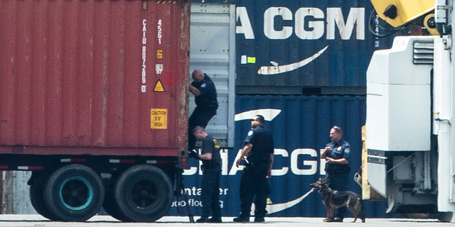 Authorities search a container along the Delaware River in Philadelphia, Tuesday, June 18, 2019. U.S. authorities have seized more than $1 billion worth of cocaine from a ship at a Philadelphia port, calling it one of the largest drug busts in American history. The U.S. attorney’s office in Philadelphia announced the massive bust on Twitter on Tuesday afternoon. Officials said agents seized about 16.5 tons (15 metric tons) of cocaine from a large ship at the Packer Marine Terminal. (AP Photo/Matt Rourke)