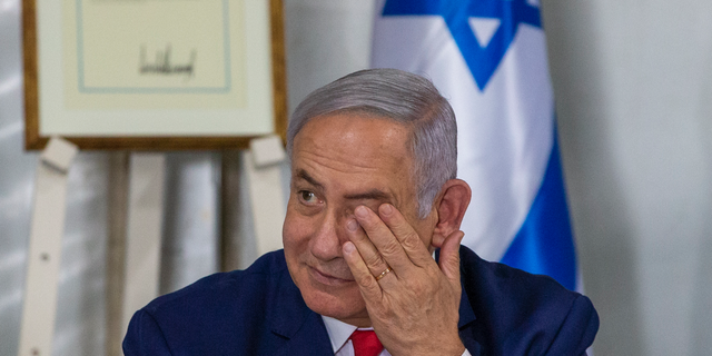 Israeli Prime Minister Benjamin Netanyahu convenes his Cabinet to inaugurate a new settlement named after President Donald Trump in a gesture of appreciation for the U.S. leader's recognition of Israeli sovereignty over the Golan Heights, Sunday, June 16, 2019. The Trump name graces apartment towers, hotels and golf courses. Now it is the namesake of a tiny Jewish settlement in the Israeli-controlled Golan Heights. (AP Photo/Ariel Schalit)