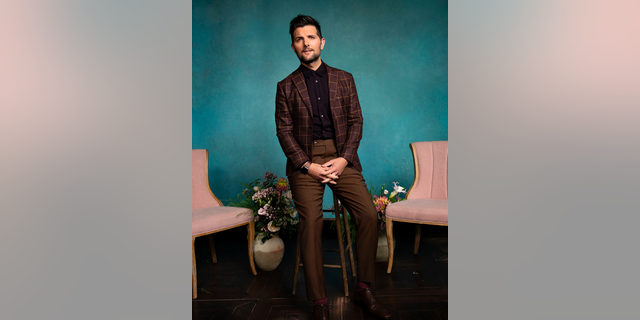 This photo provided by HBO shows Adam Scott. Scott plays Ed Mackenzie, husband to Reese Witherspoon’s Madeline, in the HBO series "Big Little Lies" returning for its second season on Sunday, June 9, 2019. (Griffin Lipson/HBO via AP)