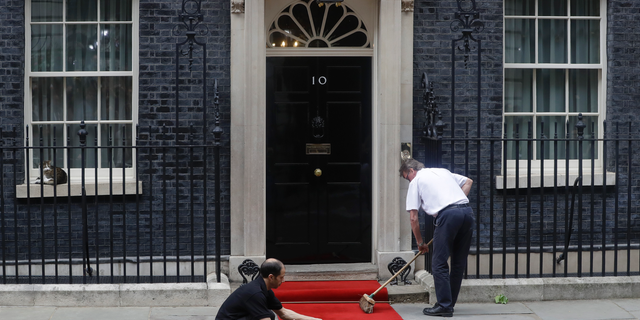FILE - In this June 4, 2019 file photo, the red carpet is rolled out outside 10 Downing Streets before the arrival of President Donald Trump in central London. Britain’s Conservative Party is holding a contest to replace Prime Minister Theresa May, who stepped down from the party helm last week after failing to deliver Brexit. The contenders have until Monday, June 10, 2019, to submit nomination papers. (AP Photo/Kirsty Wigglesworth, File)