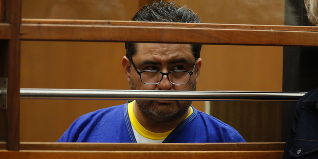 Naason Joaquin Garcia, appears in court in Los Angels, Calif. on Monday, June 10, 2019. García, and his co-defendants face a 26-count felony complaint that alleges crimes including child rape, statutory rape, molestation, human trafficking, child pornography and extortion. The charges detail allegations involving three girls and one woman between 2015 and 2018 in Los Angeles County. (Ringo Chiu/Pool Photo via AP)