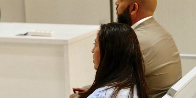 Aziz Zaghanane, right, and his wife Ana Marilu Reyna attend their trial at the National Court in Madrid, Tuesday, June 11, 2019. The Moroccan-born Spaniard and his Mexican wife are denying charges in their re-trial that they helped recruit militants for the Islamic State in Madrid. (Paco Campos/Pool Photo via AP)