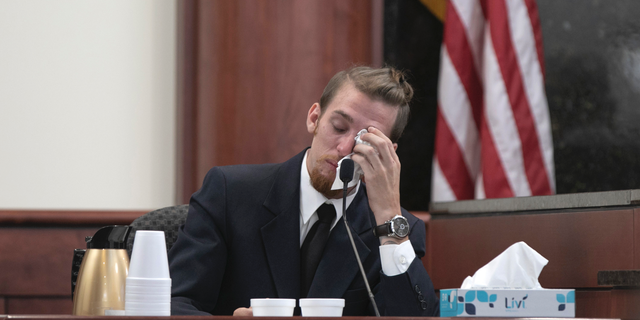 Tyler Jones wipes his eyes while testifying during the sentencing phase of the trial of his half brother, Tim Jones in Lexington, S.C., Wednesday, June 12, 2019. Timothy Jones, Jr. was found guilty of killing his 5 young children in 2014. (Tracy Glantz/The State via AP, Pool)