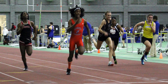 FILE - In this Feb. 7, 2019 file photo, Bloomfield High School transgender athlete Terry Miller, second from left, wins the final of the 55-meter dash over transgender athlete Andraya Yearwood, far left, and other runners in the Connecticut girls Class S indoor track meet at Hillhouse High School in New Haven, Conn. Three Connecticut girls who participate on high school track teams have filed a federal discrimination complaint against a statewide policy on transgender athletes, saying it has cost them top finishes in competitions and possibly college scholarships. (AP Photo/Pat Eaton-Robb, File)