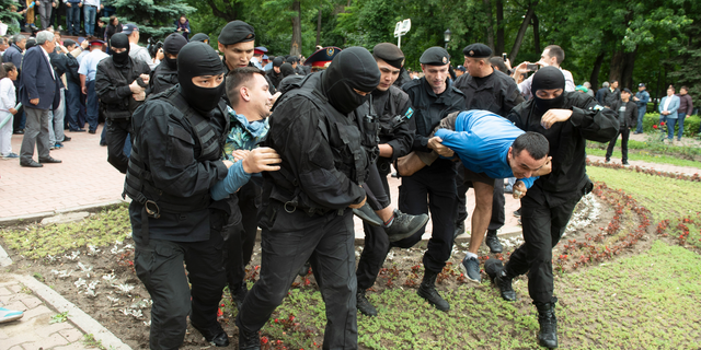 Kazakh police detain demonstrators during an anti-government protest during the presidential elections in Almaty, Kazakhstan, Sunday, June 9, 2019. Voters in Kazakhstan are choosing a successor to the president who had led the Central Asian country since independence from the Soviet Union, with a longtime loyalist expected to win easily. (AP Photo)