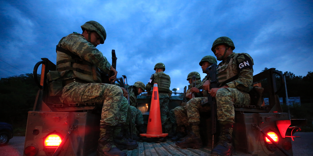 Soldiers forming part of Mexico's National Guard board a truck to patrol back roads used to circumvent a migration checkpoint, in Comitan, Chiapas state, Mexico, Saturday, June 15, 2019. Under pressure from the U.S. to slow the flow of migrants north, Mexico plans to deploy thousands of National Guard troops by Tuesday to its southern border region. (AP Photo/Rebecca Blackwell)