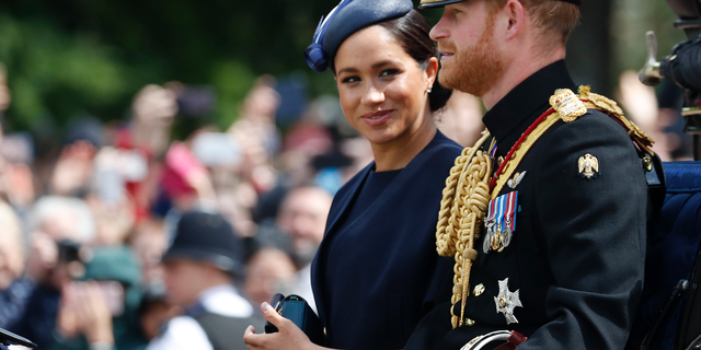 Meghan, the Duchess of Sussex and Prince Harry travel by carriage to attend the annual Trooping the Color ceremony on 8 June 2019 in London. (AP Photo / Frank Augstein, file)