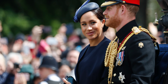 Meghan, the Duchess of Sussex and Prince Harry ride in a carriage to attend the annual Trooping the Colour Ceremony on June 8, 2019, in London. (AP Photo/Frank Augstein, file)