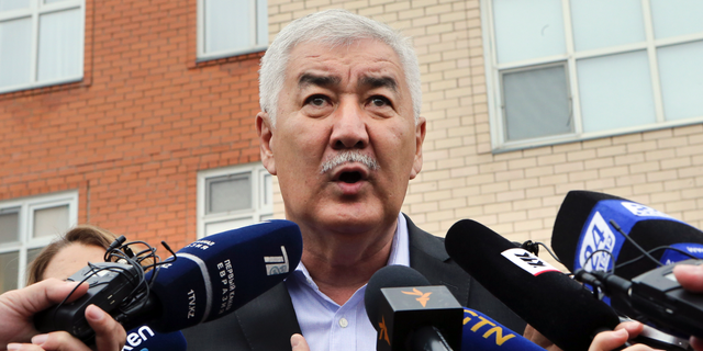 Kazakh Presidential opposition candidate Amirzhan Kossanov speaks to the media at a polling station during the presidential elections in Nur-Sultan, the capital city of Kazakhstan, Sunday, June 9, 2019. Voters in Kazakhstan are choosing a successor to the president who had led the Central Asian country since independence from the Soviet Union, with a longtime loyalist expected to win easily. (AP Photo/Alexei Filippov)