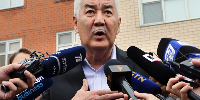 Kazakh Presidential opposition candidate Amirzhan Kossanov speaks to the media at a polling station during the presidential elections in Nur-Sultan, the capital city of Kazakhstan, Sunday, June 9, 2019. Voters in Kazakhstan are choosing a successor to the president who had led the Central Asian country since independence from the Soviet Union, with a longtime loyalist expected to win easily. (AP Photo/Alexei Filippov)