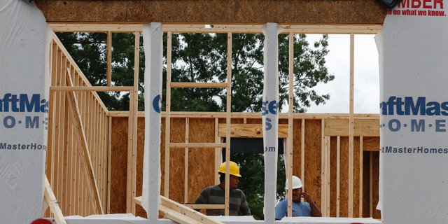 In this June 13, 2019, photo work continues on a new home in Mechanicsville, Va. On Tuesday, June 18, the Commerce Department reports on U.S. home construction in May. (AP Photo/Steve Helber)