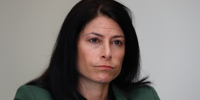 In this June 4, 2019, photo, Dana Nessel, Attorney General of Michigan, listens to a question from reporters in Detroit. Hundreds of boxes. Millions of records. From Texas to Michigan this month, attorneys general are sifting through "secret" files, nondisclosure agreements between the church and families, heart wrenching letters from parents begging for action, priests' own psychiatric evaluations. They're looking to prosecute, and not just priests. (AP Photo/Paul Sancya)