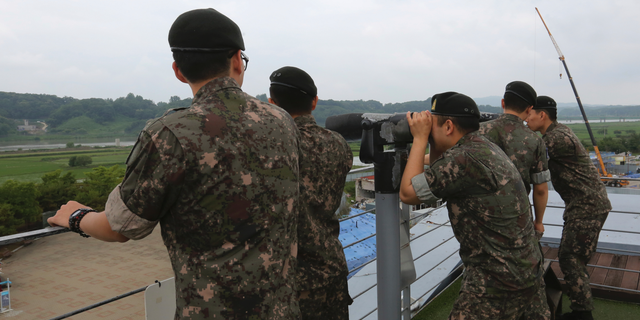 South Korean army soldiers look toward the North's side at the Imjingak Pavilion, near the demilitarized zone of Panmunjom, in Paju, South Korea, Thursday, June 20, 2019. Chinese President Xi Jinping departed Thursday morning for a state visit to North Korea, where he's expected to talk with leader Kim Jong Un about his nuclear program while negotiations have stalled with Washington. (AP Photo/Ahn Young-joon)
