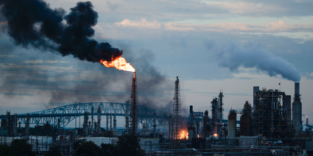 In this June 21 photo, flames and smoke emerge from the Philadelphia Energy Solutions Refining Complex in Philadelphia. (AP Photo/Matt Rourke, File)