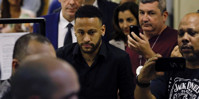 Brazilian soccer player Neymar leaves police headquarters in Rio de Janeiro, Brazil, Thursday, June 6, 2019. Neymar went to the headquarters in an investigation linked to a woman’s rape allegation against him. (AP Photo/Leo Correa)