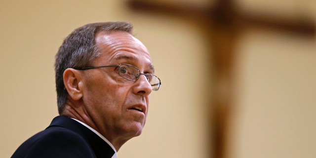 Bishop Charles Thompson speaks after he is introduced as the new archbishop of Indianapolis in Indianapolis in June 2017. The Archdiocese of Indianapolis says it no longer will recognize a Jesuit high school as Catholic because it refuses to fire a teacher who's in a same-sex marriage.
