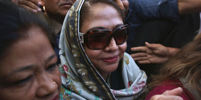 FILE - In this Jan. 7, 2019 file photo, Faryal Talpur, center, sister of former Pakistani president Asif Ali Zardari, arrives to appear in a court in Karachi, Pakistan. Talpur has been arrested by Pakistan’s anti-graft body in connection with a multi-million-dollar money laundering case following rejection of her bail by a court. Talpur, also a politician, was taken into custody Thursday, June 13, by the National Accountability Bureau in Islamabad. The latest development came days after a court rejected bail requests from Zardari and Talpur, drawing condemnation from the opposition, which has accused Prime Minister Imran Khan of victimizing his opponents. (AP Photo/Shakil Adil)