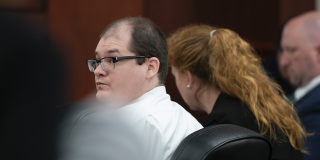 Timothy Jones Jr. looks around the courtroom during closing arguments of his trial in Lexington, S.C. on Thursday, June 13, 2019.  Jones, Jr. was found guilty of killing his five young children in 2014. (Tracy Glantz/The State via AP, Pool)/