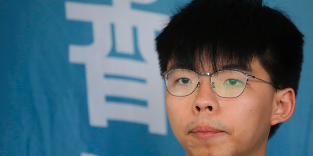 FILE - In this May 16, 2019, file photo, Pro-democracy activist Joshua Wong speaks to media at a court in Hong Kong. Members of his Demosisto party say the Hong Kong activist Wong, a leading figure in the 2014 Umbrella Movement, is to be released from prison. Wong’s release from the Lai Chi Kok Correctional Facility comes as student demonstrators were facing off Monday, June 17, against police following a massive protest on Sunday. (AP Photo/Kin Cheung, File)