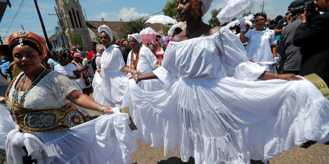 A funeral procession for Leah Chase from St. Peter Claver Church to her restaurant in New Orleans on Monday. (AP Photo/Gerald Herbert)
