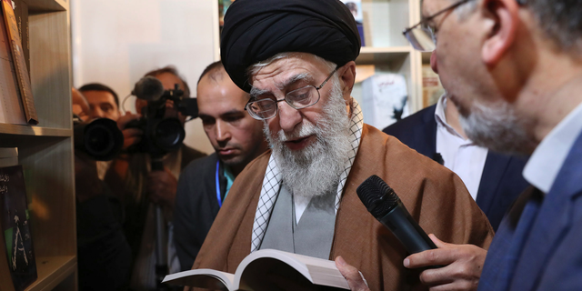 In this picture released on April 29, 2019, by the official website of the office of the Iranian supreme leader, Supreme Leader Ayatollah Ali Khamenei reads part of a book while visiting Tehran's book fair in Tehran, Iran. President Donald Trump signed an executive order on Monday, June 24, 2019, targeting Iran's supreme leader and his associates with financial sanctions, the latest action the U.S. has taken to discourage Tehran from developing nuclear weapons and supporting militant groups. (Office of the Iranian Supreme Leader via AP)