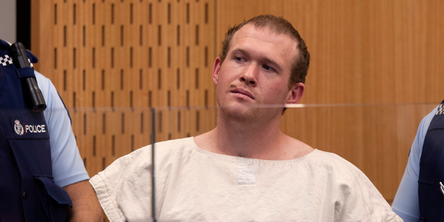 In this Saturday, March 16, 2019 photo, Brenton Tarrant, the man charged in the Christchurch mosque shootings, appears in the Christchurch District Court, in Christchurch, New Zealand.