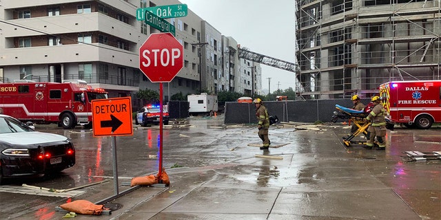 The crane fell into a downtown apartment building Sunday afternoon as strong winds, heavy rain and hail battered parts of North Texas. (Jordan Grinnell)