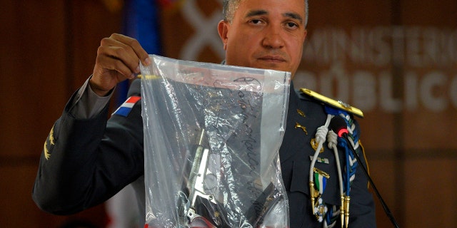 The director of the National Police, General Ney Aldrin Bautista Almonte shows the weapon that was used to shoot former Boston Red Sox slugger David Ortiz. (AP Photo / Roberto Guzman)