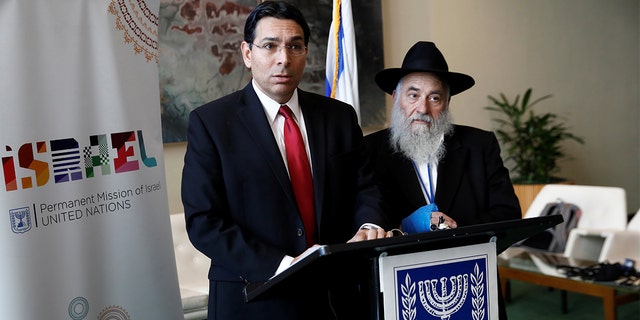 Israeli Ambassador to the United Nations Danny Danon and Rabbi Yisroel Goldstein address reporters Wednesday. (REUTERS/Shannon Stapleton)