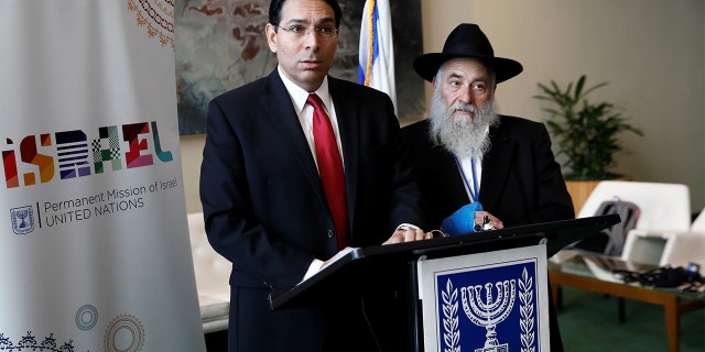 Israeli Ambassador to the United Nations Danny Danon and Rabbi Yisroel Goldstein address reporters Wednesday. (REUTERS/Shannon Stapleton)