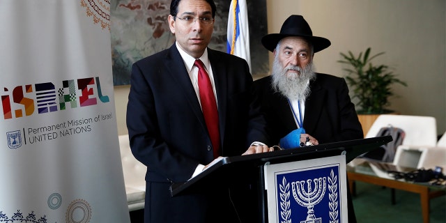 Israeli Ambassador to the United Nations Danny Danon and Rabbi Yisroel Goldstein address reporters Wednesday. (REUTERS/Shannon Stapleton)