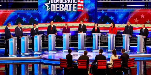 Democratic presidential candidate former Housing and Urban Development Secretary Julian Castro, third from left, answers a question, during a Democratic primary debate hosted by NBC News at the Adrienne Arsht Center for the Performing Art, Thursday, June 27, 2019, in Miami. (AP Photo/Wilfredo Lee)