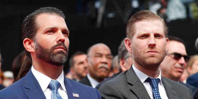 Donald Trump Jr., left, and Eric Trump attend a ceremony to mark the 75th anniversary of D-Day at the Normandy American Cemetery in Colleville-sur-Mer, Normandy, France, Thursday, June 6, 2019. (Ian Langsdon/POOL via AP)