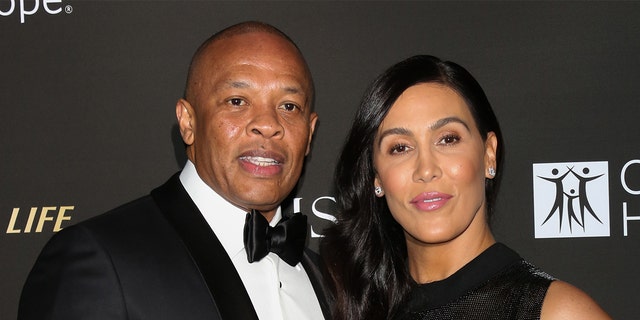 Dr. Dre (left) and his wife Nicole Young are divorcing. (Photo by Paul Archuleta/FilmMagic)