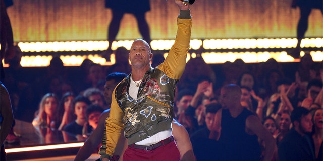 Dwayne Johnson, also known as The Rock, accepts the generation award at the MTV Movie and TV Awards on Saturday, June 15, 2019, at the Barker Hangar in Santa Monica, Calif. (Photo by Chris Pizzello/Invision/AP)