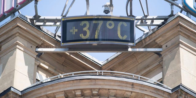 A sign shows 37 degrees Celsius at a building in the city of Stuttgart, Germany, Wednesday, June 26, 2019.