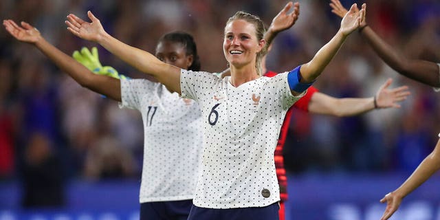 France's Amandine Henry celebrates at the end of the Women's World Cup round of 16 soccer match between France and Brazil at the Oceane stadium in Le Havre, France, Sunday, June 23, 2019. France beat Brazil 2-1. (AP Photo/Francisco Seco)