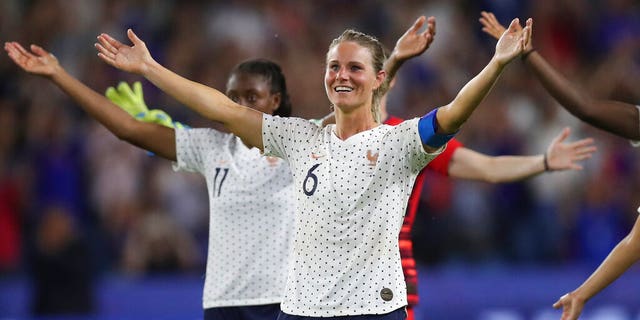 France's Amandine Henry celebrates at the end of the Women's World Cup round of 16 soccer match between France and Brazil at the Oceane stadium in Le Havre, France, Sunday, June 23, 2019. France beat Brazil 2-1. (AP Photo/Francisco Seco)