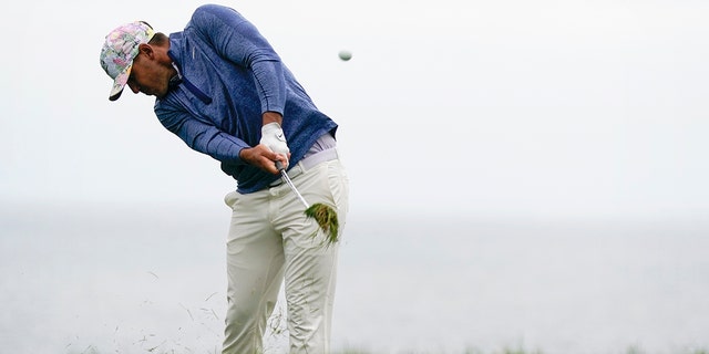 Brooks Koepka hits from the rough on the 11th hole during the first round of the U.S. Open Championship golf tournament Thursday, June 13, 2019, in Pebble Beach, Calif. (AP Photo/David J. Phillip)