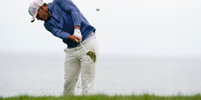 Brooks Koepka hits from the rough on the 11th hole during the first round of the U.S. Open Championship golf tournament Thursday, June 13, 2019, in Pebble Beach, Calif. (AP Photo/David J. Phillip)