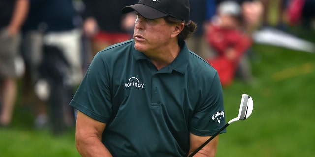 Phil Mickelson reacts to missing a birdie putt on the 9th green during first round play at the Travelers Championship golf tournament at TPC River Highlands, Thursday, June 20, 2019 in Cromwell, Conn.(Brad Horrigan/Hartford Courant via AP)