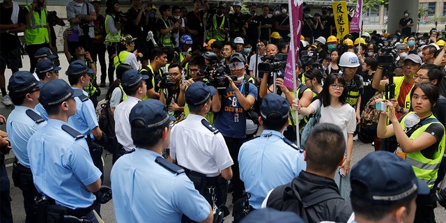 Protesters negotiating with police outside the Legislative Council building in Hong Kong.