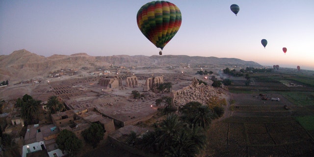 Nearly 360 tourists partake in hot air balloon tours over            the city of Luxor and its surrounding area, as seen here in a            2007 photo.